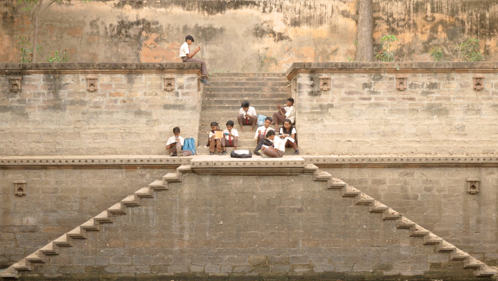 The Everything Book group of children on fortress staircase